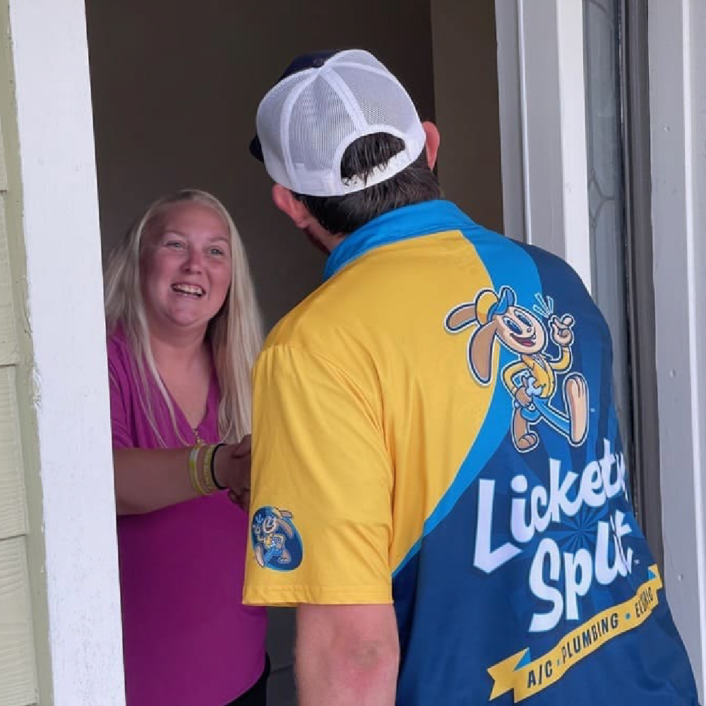 Lickety Split plumber removing odor-causing buildup from a Northeast Florida home